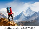 Active hiker enjoying the view. Himalayas. Nepal