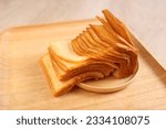 Thousand layer toast on wooden dish