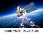 Space Satellite Orbiting The...