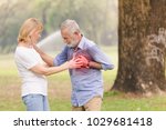 Small photo of Senior men cardiac arrest heart attack in park.Severe heartache