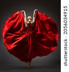 Small photo of Ballerina Dancing in Red Flying Dress Rear Back Side View. Graceful Woman Ballet Performer in Flamenco Skirt. Expressive Passion Dance in Motion over Dark Background