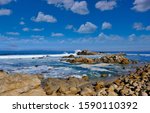 Rocks And Surf Off Of Coast Of...