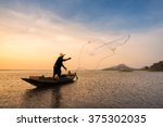 Asian Fisherman On Wooden Boat...