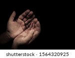 Small photo of hand of child supplicate Almighty in the night