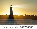 Lighthouse With Light Beam At...