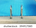 a steps in blue water pool | Shutterstock . vector #394917085