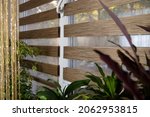 Small photo of In the apartment on a modern metal-plastic window there are blinds from light brown fabric which are called - day and night daylight roller blind. Day and night blinds give privacy at night
