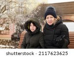 Small photo of Woman with teenage daughter trying to communicate, find common ground, mother's surprise on the face and many questions. Mom and teenage daughter in the winter city walking and talking about teens