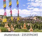 Small photo of Pattaya, Thailand - August 27nd 2023: The French Garden and Dinosaur Park at Nong Nooch Wonder World at Pattaya, Thailand. Nong Nooch is a large park with gardens, flowers, architecture and animals.