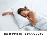Pillows. Woman Resting On White Pillow Sleeping In Bed