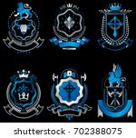 vintage heraldic coat of arms... | Shutterstock . vector #702388075