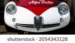 Small photo of Italy, september 11 2021. Vallelunga classic. Vintage motorsport, 60s car Alfa Romeo Giulia TZ shiny detail, front hood with logo brand name