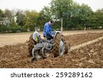Small photo of BASINGSTOKE, UK OCTOBER 12, 2014: John Evans competing in the British National Ploughing Championships organised by Society of Ploughmen. Ferguson Ploughing Championship. Accredited photographer.