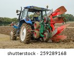 Small photo of BASINGSTOKE, UK OCTOBER 12, 2014: A competitor in the one way ploughing reversible class at the British National Ploughing Championships organised by Society of Ploughmen. Accredited photographer