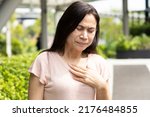 Small photo of Middle-aged woman having gerd acid reflux, heartburn inflammation
