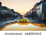 Taxi car on the city street at dusk.  Wenceslas Square, Prague, Czech Republic