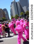 Small photo of SAN FRANCISCO, CA - MAY 12: Colorful pink "gorillas" promote the famous Zazzle Bay-to-Breakers Race to tourists at the Embarcadero on May 12, 2012, in San Francisco, California.