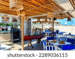 Small photo of Rio de Janeiro, Brazil - April 4, 2023: Rustic beach restaurant business located on the promenade of Copacabana Beach.
