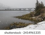 Small photo of Isaac Lee Paterson bridge expanding across the Rogue river in extreme and rare winter conditions, Gold Beach, Oregon late February 2023