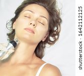 Small photo of Dermatology skin care facial therapy. Medical spa anto wrinkles procedure. Woman face rejuvenation. Pretty girl. Rf cosmetician equipment. Chin and neck.