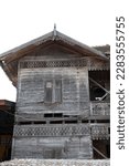 Small photo of Front view of an old dilapidated wooden building devoid of inhabitants in Thailand
