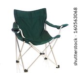 A Green Folding Lawn Chair On A ...