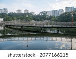Small photo of Singapore- 23 Oct, 2021: People execises on the Pang Sua boardwalk on the Pang Sua Pond in Bukit Panjang, Singapore.