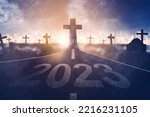 Image of 2023 number with Cross symbol at end road in the cemetery background