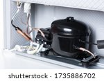 Close up refrigerator compressor mounted on the minibar. 