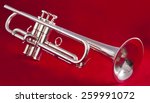silver trumpet on red background | Shutterstock . vector #259991072