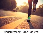 young fitness woman runner athlete running at road