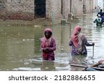 Small photo of HYDERABAD, PAKISTAN - JUL 26: Destruction due to stagnant rainwater causing of poor sewerage system creating problem for commuters and residents after flood flowed in area on July 26 2022 in Hyderabad