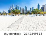 Small photo of Dubai jumeirah beach with marina skyscrapers in UAE. Popular public JBR beach