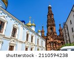 Small photo of Epiphany Cathedral with ornate bell tower, Kazan, Tatarstan, Russia. This old tall belfry is landmark of Kazan. Panorama of historical buildings on Bauman street in Kazan city center in summer.