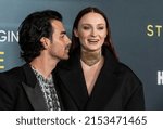 Small photo of New York, NY - May 3, 2022: Joe Jonas and Sophie Turner wearing dress by Louis Vuitton attends 'The Staircase' TV show premiere at MoMA