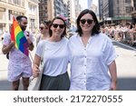 Small photo of New York, NY - June 26, 2022: US Senator Chuck Schumer daughter Alison (R) and her spouse Elizabeth Weiland (L) march with Pride parade on theme "Unapologetically Us" on 5th Avenue