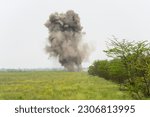 Small photo of Controlled explosion of unexploded munition collected by de-mining unit of National Guards of Ukraine seen in near Kherson in Ukraine on May 22, 2023