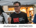 Small photo of Stephen Colbert serves ice cream to striking members of Writers Guild of America picketing in front of Warner Brothers Discovery office, New York on July 25, 2023 despite heavy rain.