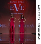 Small photo of New York, NY USA - Feb 9, 2017: Nicole Hardy & Odilia Flores in Black Halo Eve by Laurel Berman walk runway for the Red Dress Collection 2017 at Hammerstein Ballroom benefit American Heart Association