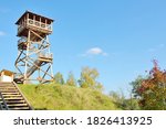 Low angle view of the stairway to the modern wooden bird watching tower on the lake shore, Latvia. Clear blue sky. Architecture, object, travel destinations, eco tourism, environmental conservation