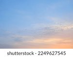 Clear blue sky. Pink and golden glowing clouds. Sunrise. Dramatic cloudscape. Concept art, meteorology, heaven, hope, peace, graphic resources, picturesque panoramic scenery