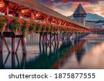 Сharm of the ancient cities of Europe. Famous old wooden Chapel Bridge (Kapellbrucke), landmark 1300s wooden bridge, Lucerne cityscape, Switzerland, Europe.