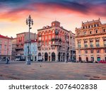 Small photo of Gorgeous summer sunrise in Trieste, Italy, Europe. Splendid morning view of Piazza del Ponte rosso Town square. Traveling concept background.