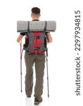 Small photo of Back view portrait of hiker with a backpack and trekking poles isolated on white background. Thirty years old man posing in studio.