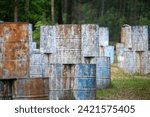 Metal barrels in paint from a...