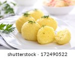 Fresh potato dumpling on a white plate