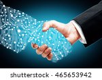 Businessman shaking digital partners hand on blue background