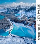 Small photo of Overhead view of a road through a snow covered landscape in the far north of Canada - AI generated
