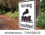Small photo of sign with the german words take precedence