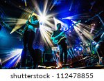 Small photo of SEATTLE - SEPTEMBER 3, 2012: French electronic pop band M83 performs on the main stage at Key Arena during the Bumbershoot music festival in Seattle on September 3, 2012.